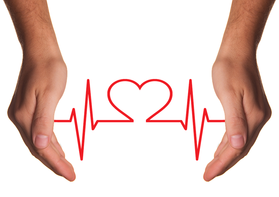 Two hands holding a heart-shaped pulse line symbol representing emergency care and heart health