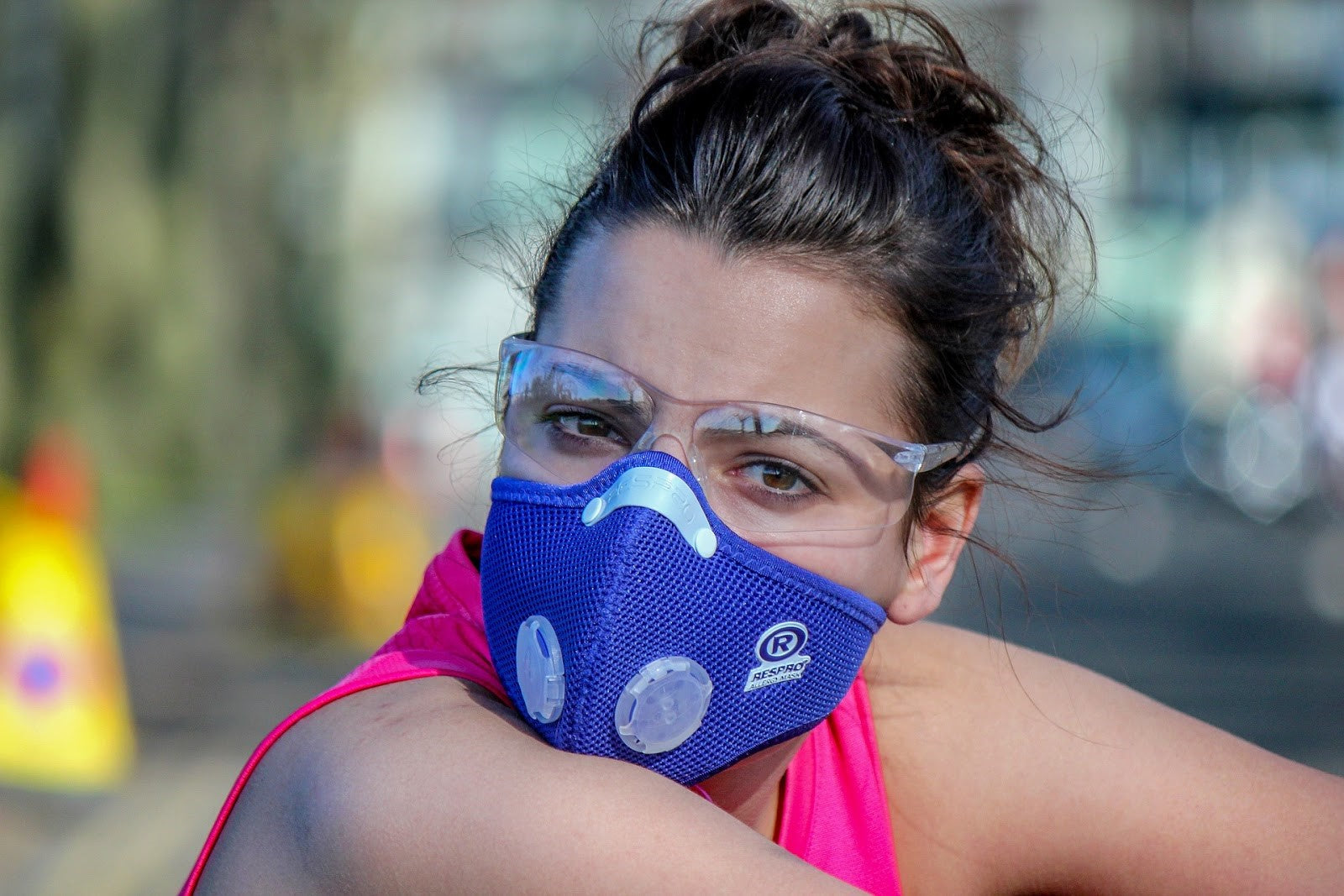 Woman wearing asthma mask outdoors for respiratory support