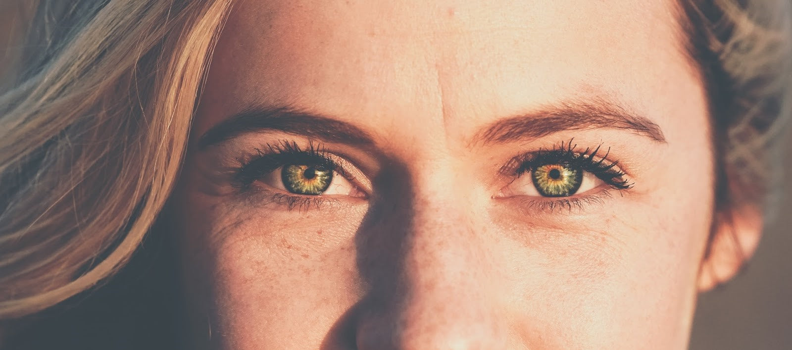 Close-up of woman's eyes looking directly at camera, illustrating post-LASIK eye sensitivity or dry eye concerns