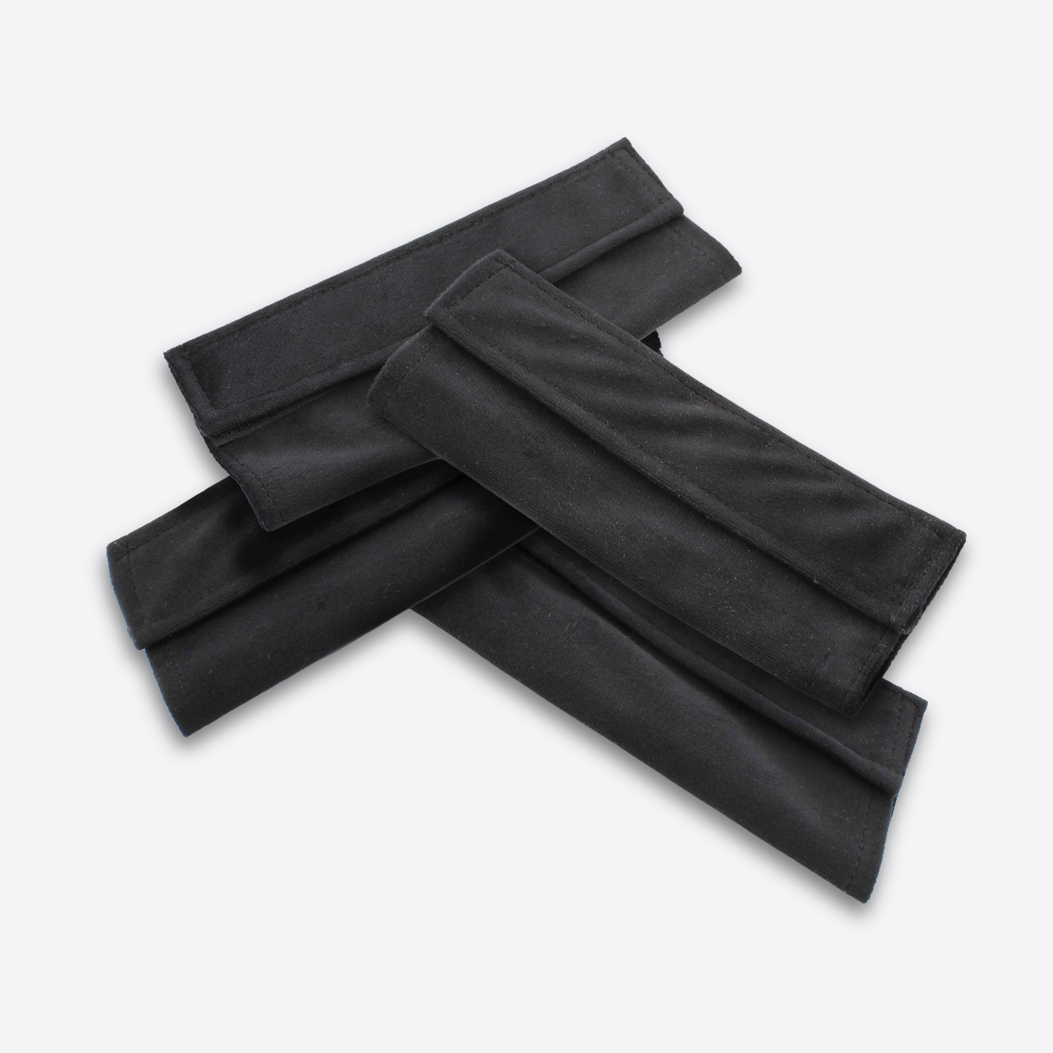 Set of four reusable black fabric mask covers from Wizard Research displayed on a white background
